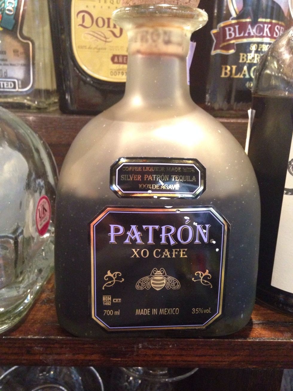 Next take a coffee liqueur and add 25 ml (1oz). Here I've chosen Patron because I like the strength it has over other liqueurs.