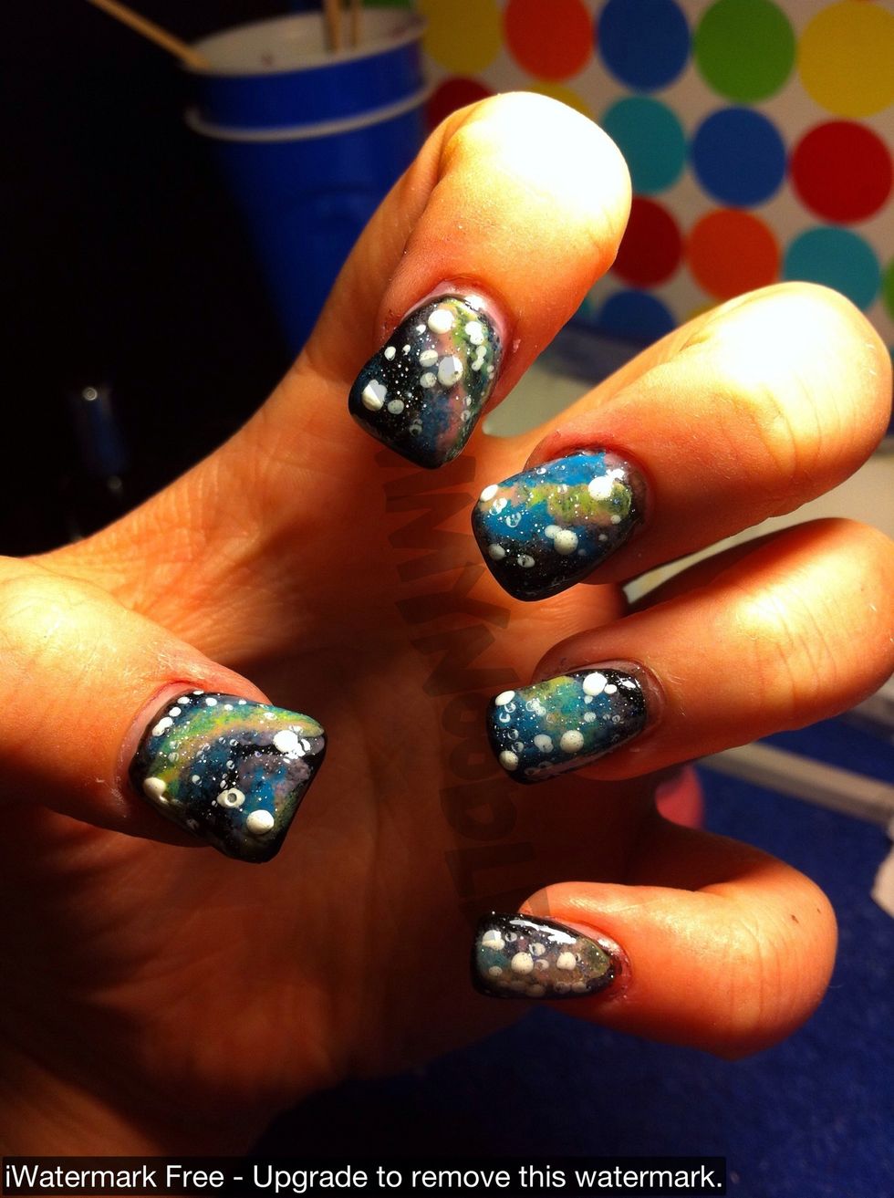 Next take a fine glitter topcoat and apply for even smaller stars. This gives a great effect!