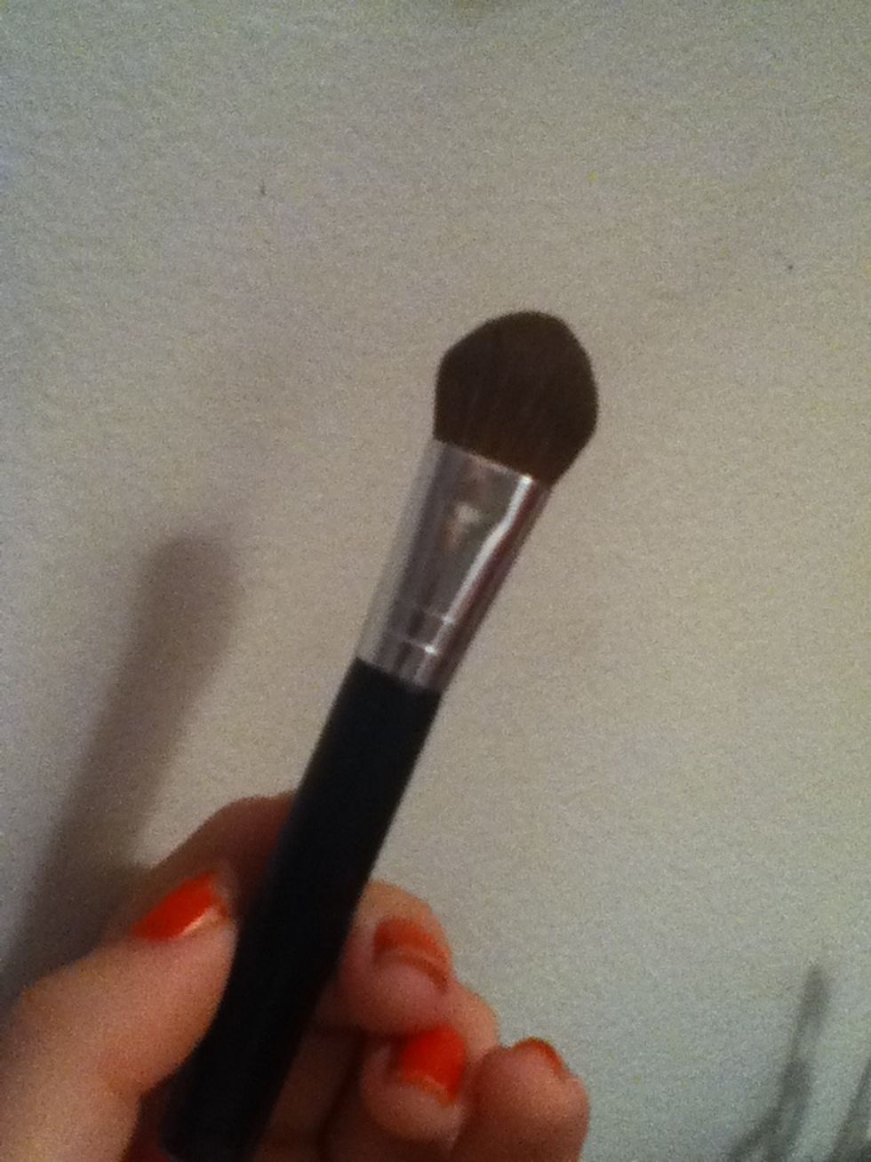 Next take a fluffy brush like the one shown. And using the face powder from earlier, apply it LIGHTLY to your eyelids, you can apply it everywhere you put primer, to help it last longer.