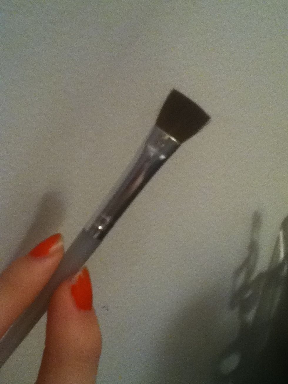 Next take a fluffy flat topped brush and....