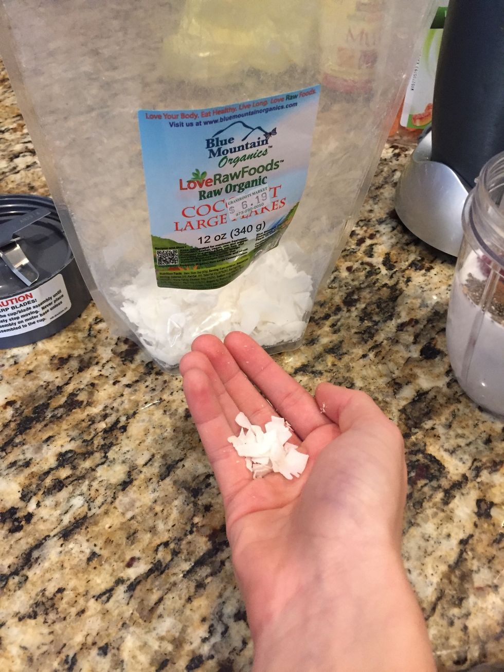 Next take a little pinch of dried coconut flakes