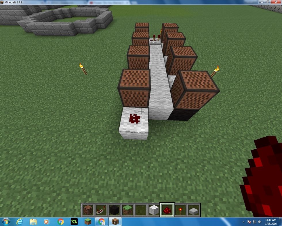 Next take another block of Wool and place it behind the first Note Block that you put down, put one Redstone on top of it.