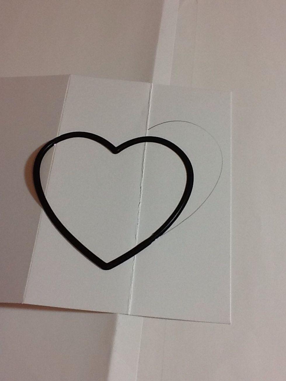 Next take one of your heart dies or the template your using (if your really good free hand draw!) and pencil half the heart on your right hand side