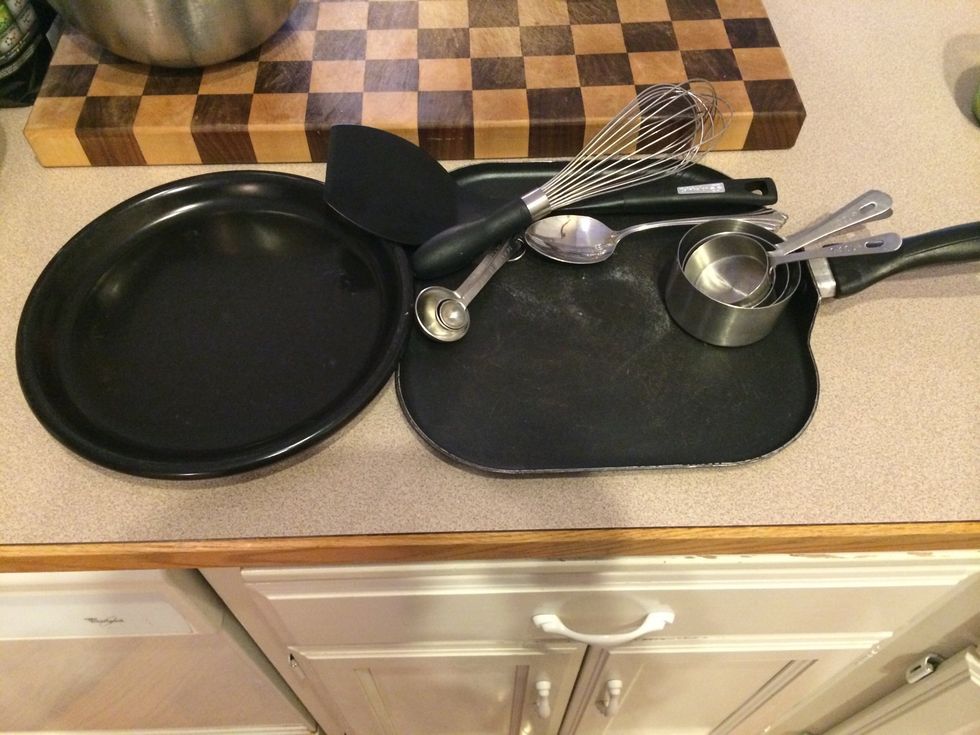 Next, take out all of the utensils you will need to help make pancakes. You may want to take out measuring cups, whisk, spoon, turner, plate, and a pan.