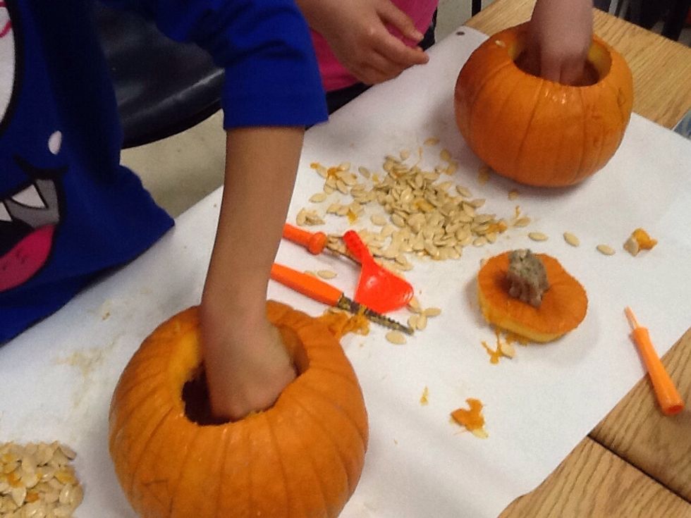 Next take out all the disgusting, gooey,squishy guts and seeds!