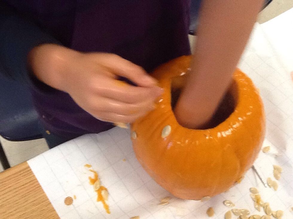 Next, take the guts out of the pumpkin.