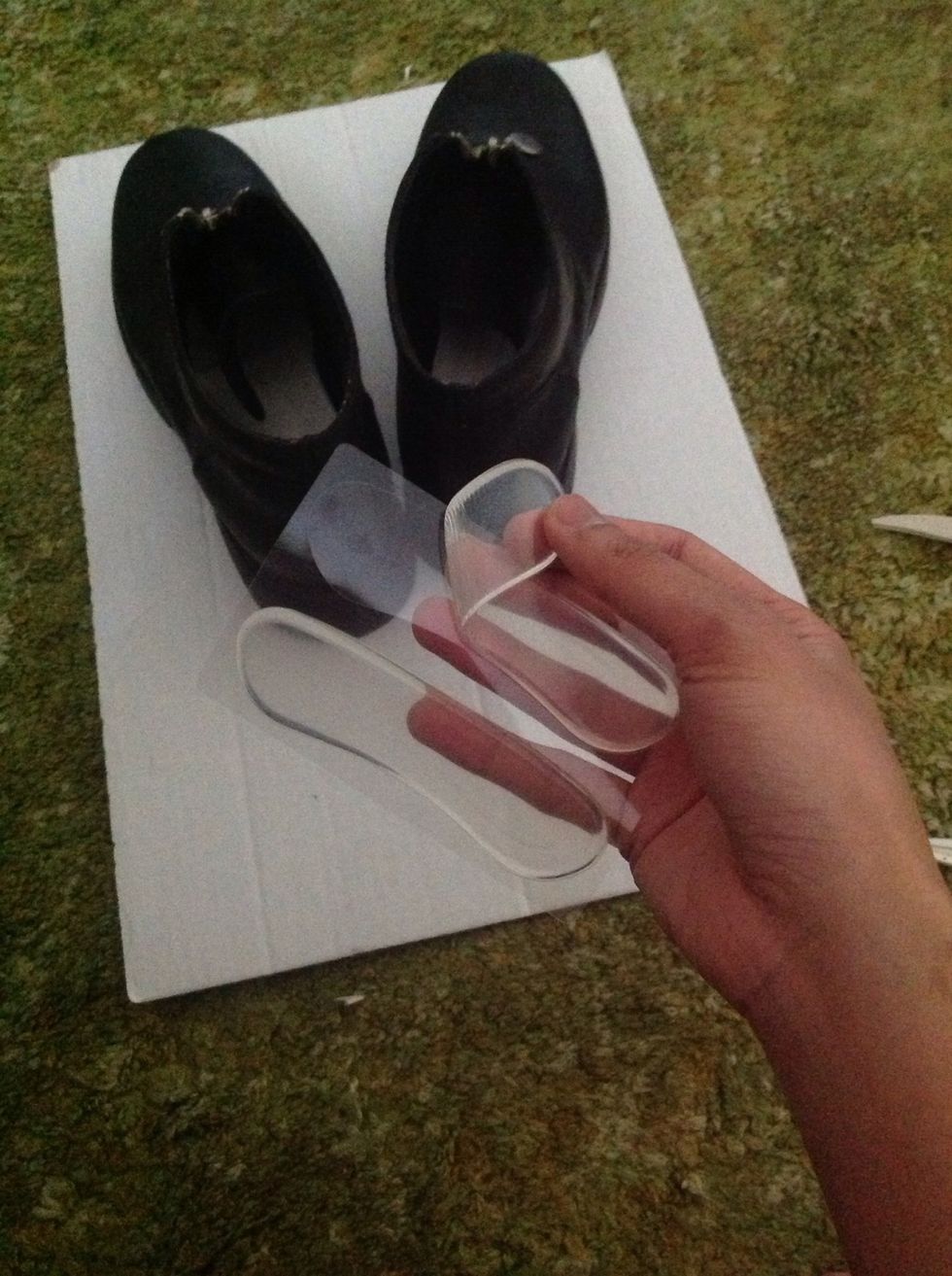 Next, take the heel shields and peel them away from the protective film.
