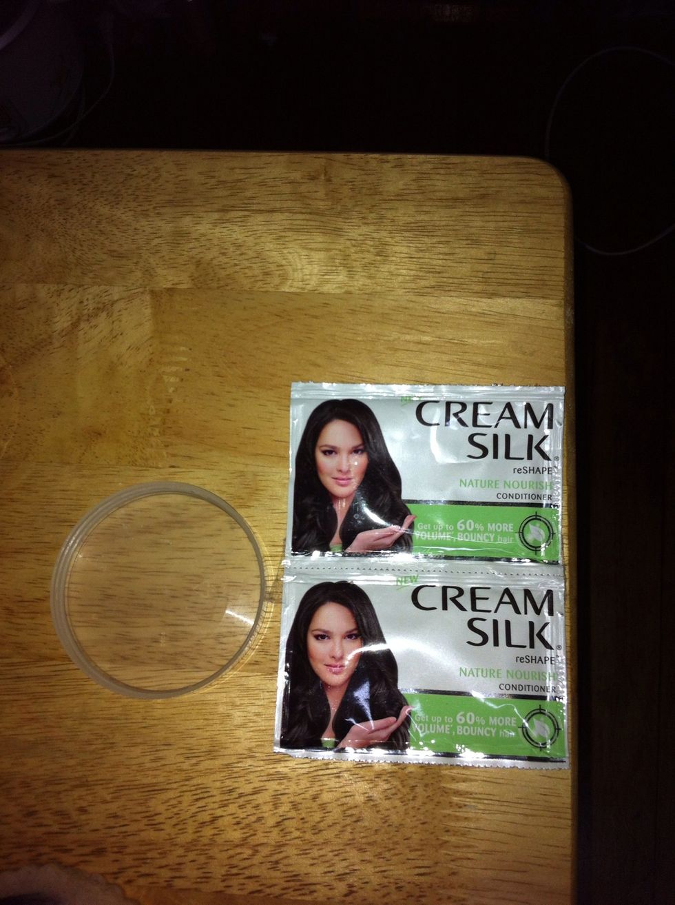 Next,take the lid of the container or anything you can use to pour enough conditioner to use for your brushes.