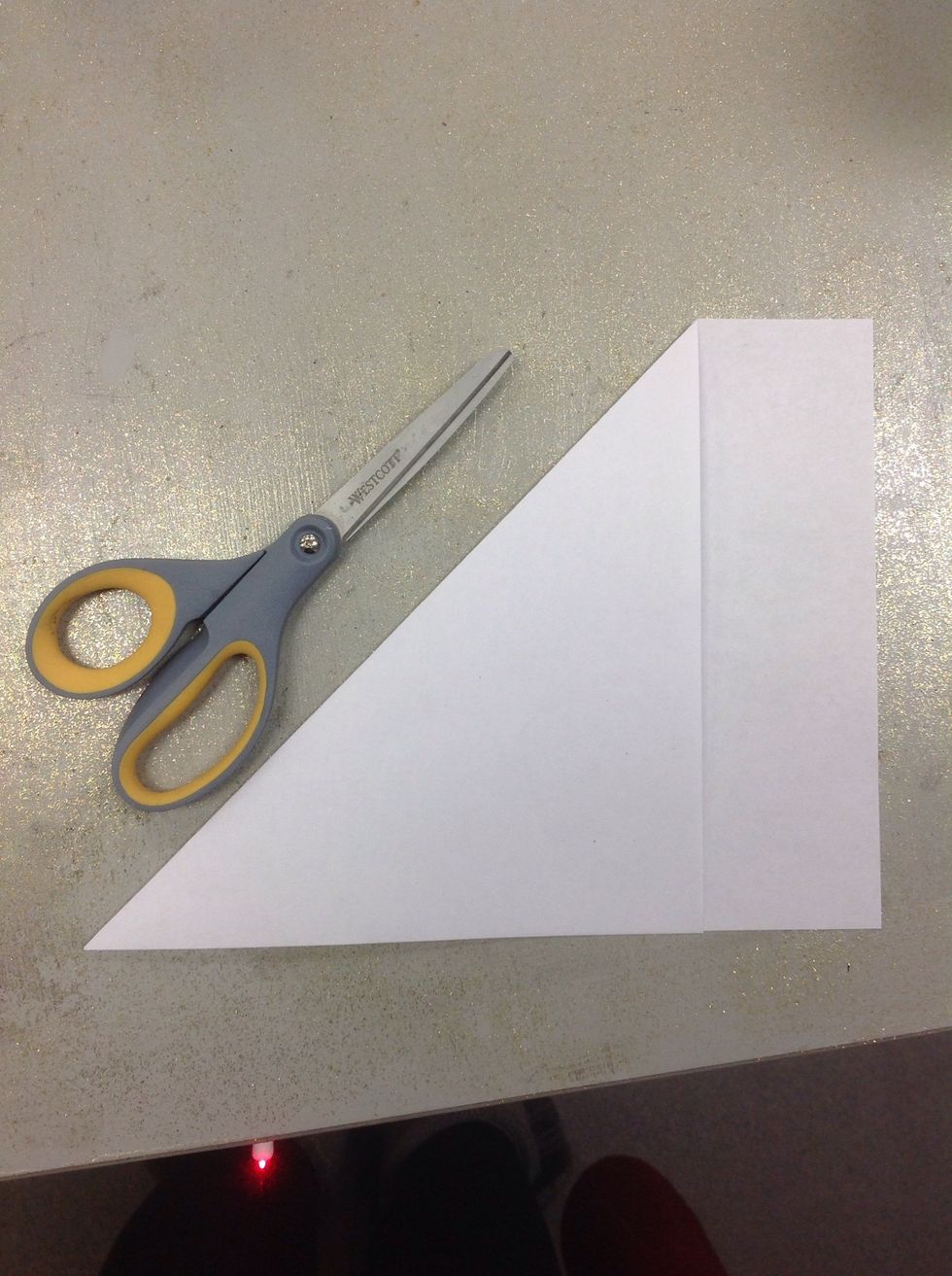 Next, take the short side and line it up with the long side of the paper to form a right triangle with a bit of extra paper at the end. It's important that your sides line up as straight as you can.