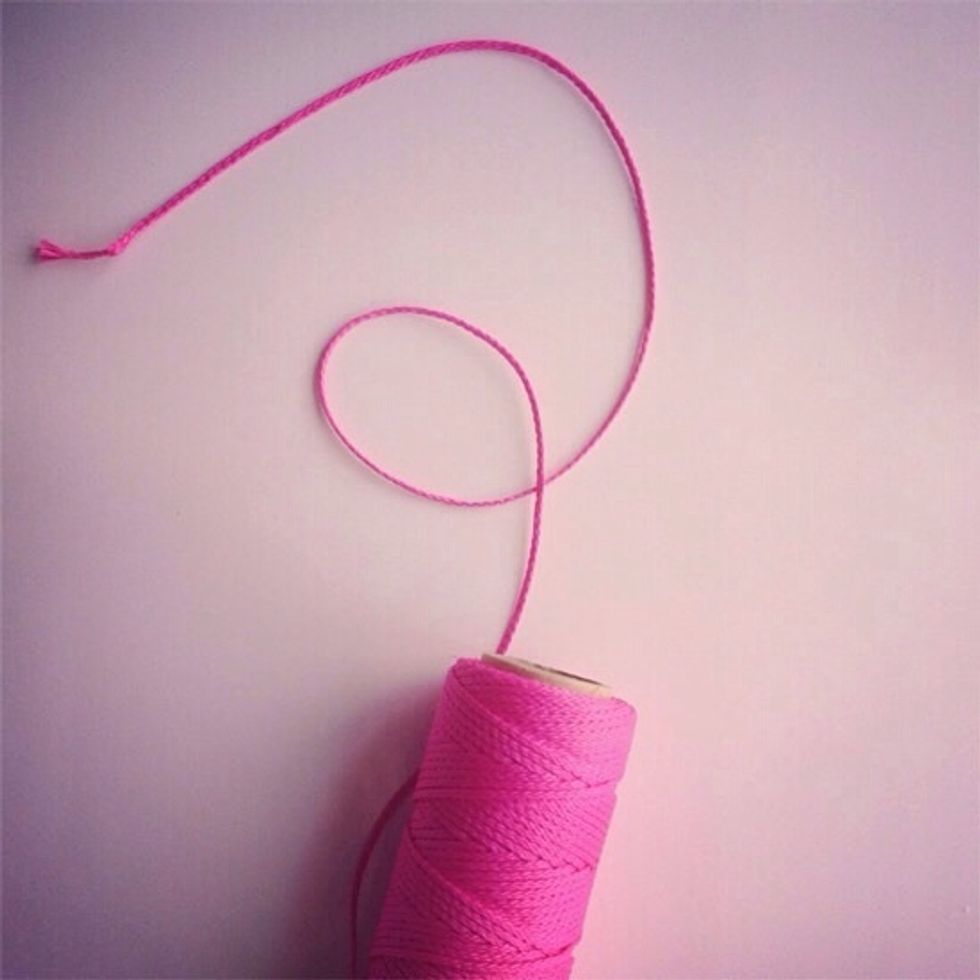 Next, take the the string and wrap it around the top of the jar, and place the cork back in. Remember to tie the string in a bow!