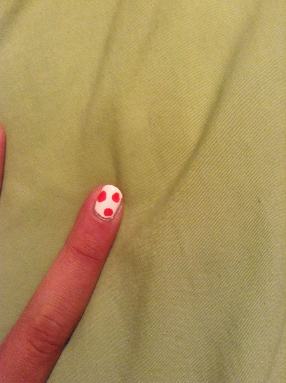 Next take your dotting tool and make dots on your finger, they don't have to be perfect. Don't do to many because you will need room to make the leafs.