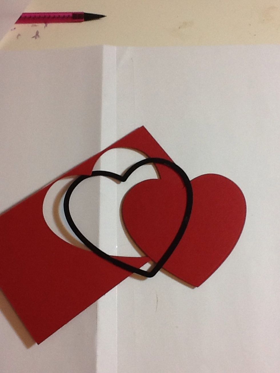 Next take your heart die/template and the red card again. Cut out one large red heart