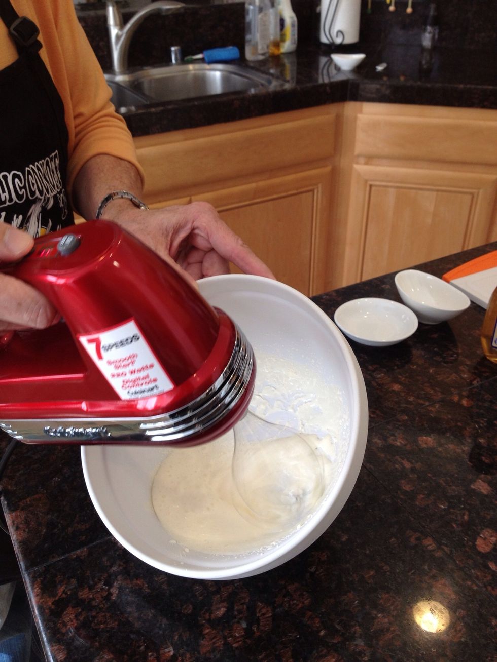 Next, take your mixing bowl out of the freezer. Pour in the remaining cream and whip with the whisk attachment. Freezing the bowl makes the cream whip faster.