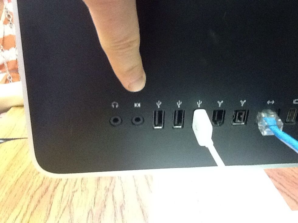 Next, take your patch cord and plug it into the "Auxiliary Cord Jack."