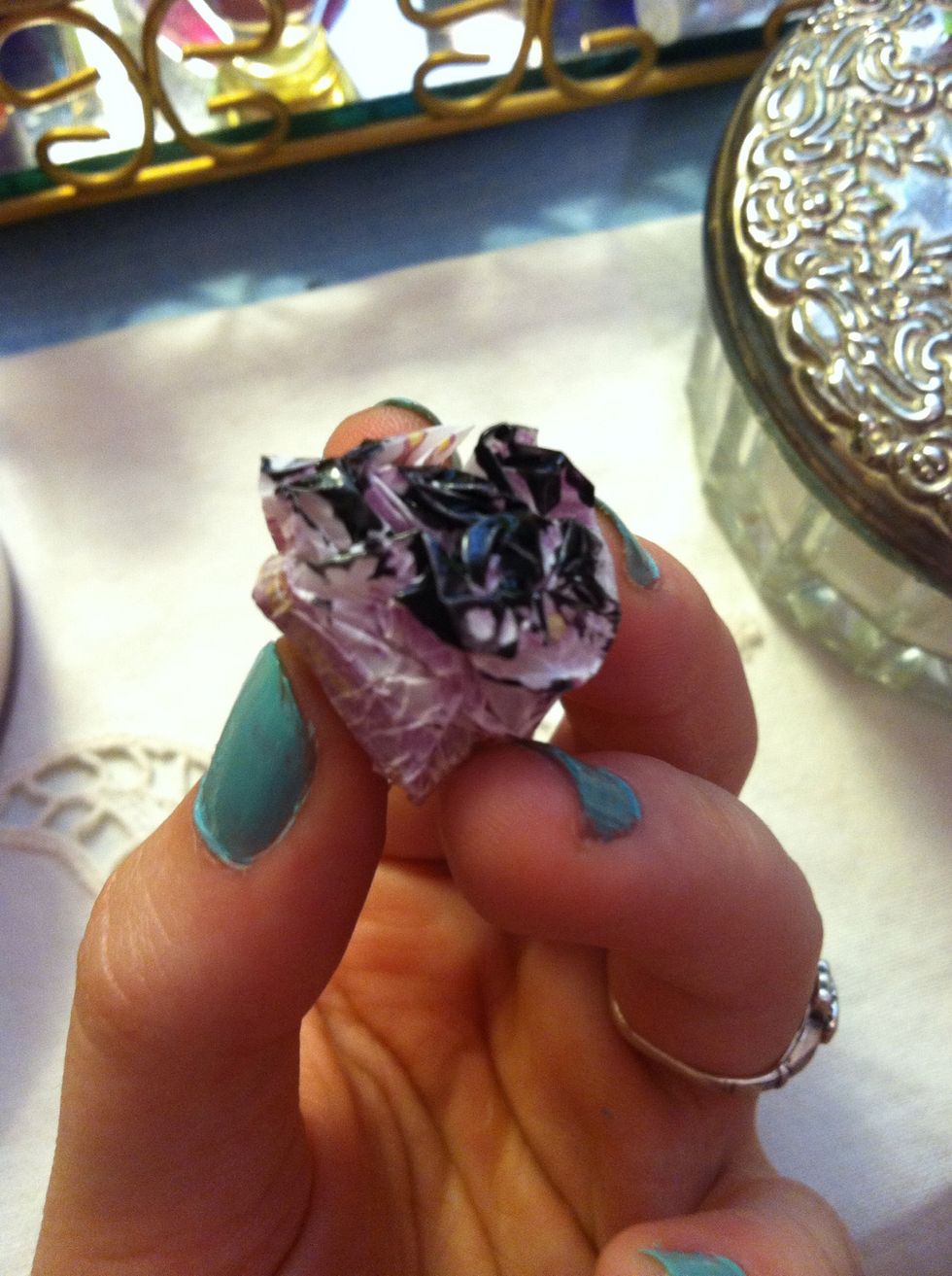 Next, take your wrapper and crinkle it up into a ball. Then, paint on some black polish onto the top as so! (Make sure it is spread evenly to avoid it becoming too dark!)