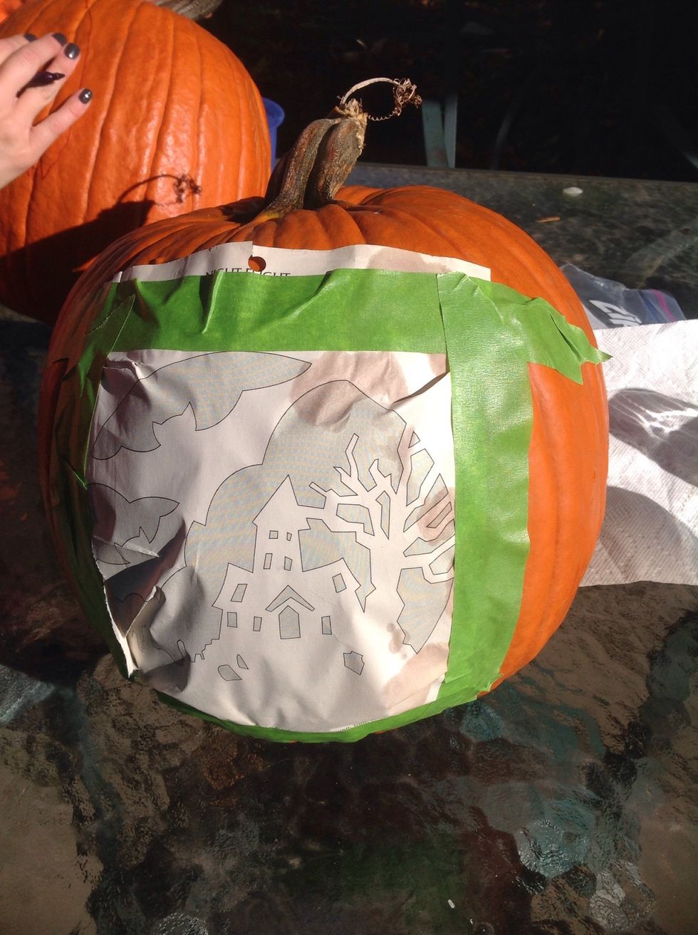 Next, tape the picture to your pumpkin.