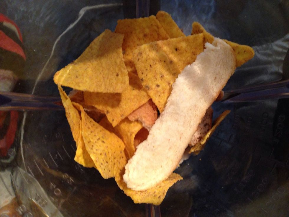 Next Tear your bread into strips and with the tortilla chips put them in your blender