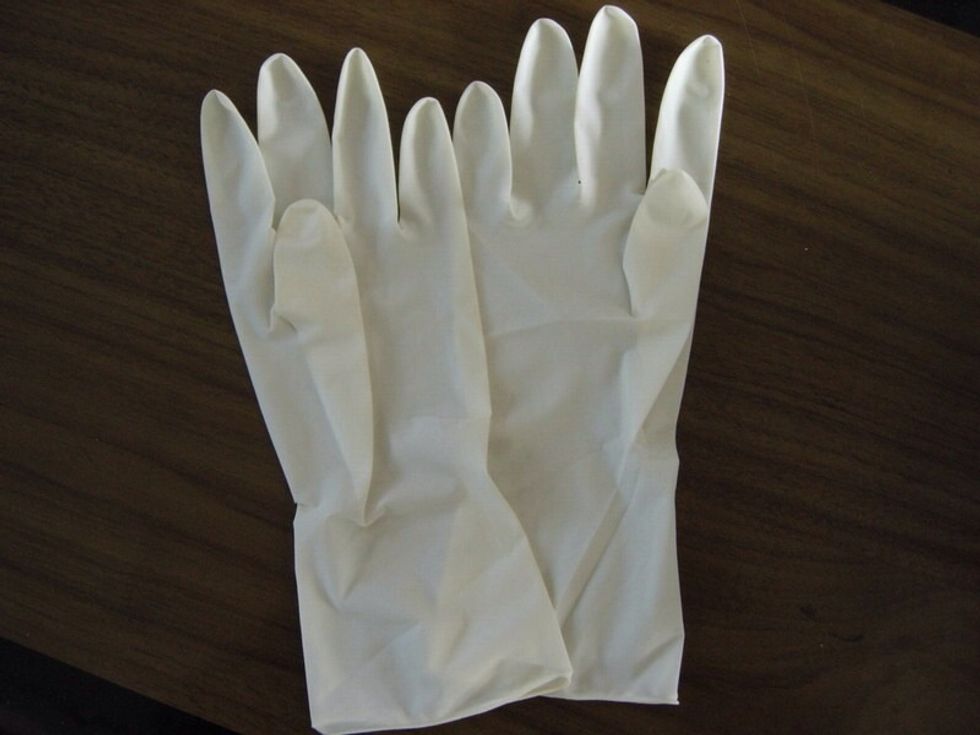 Next the gloves will come out clean so you can put water into them and tie the top like a water ballon