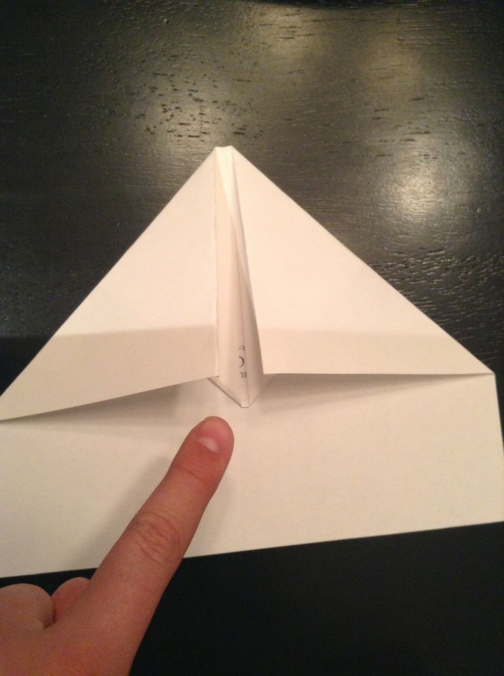 Next, there is a small corner sticking out. Fold this back........