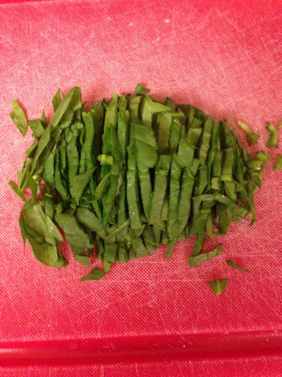 Next, thinly sliced the spinach (also called a chiffonade).