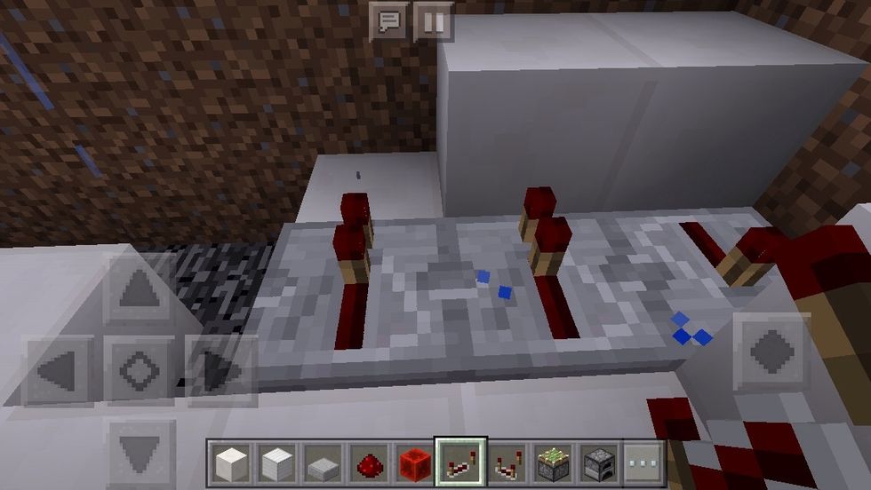 Next to it, turn around and place two redstone repeaters.