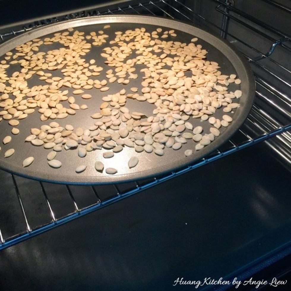 Next, toast melon seeds in the preheated oven for 5 minutes. Set aside to cool.