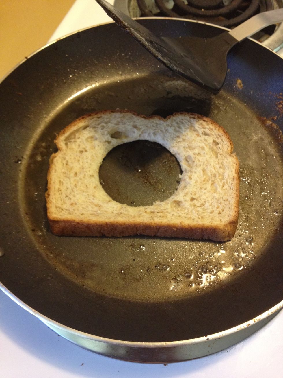 Next, turn on the heat, butter your pan, and put your bread in.