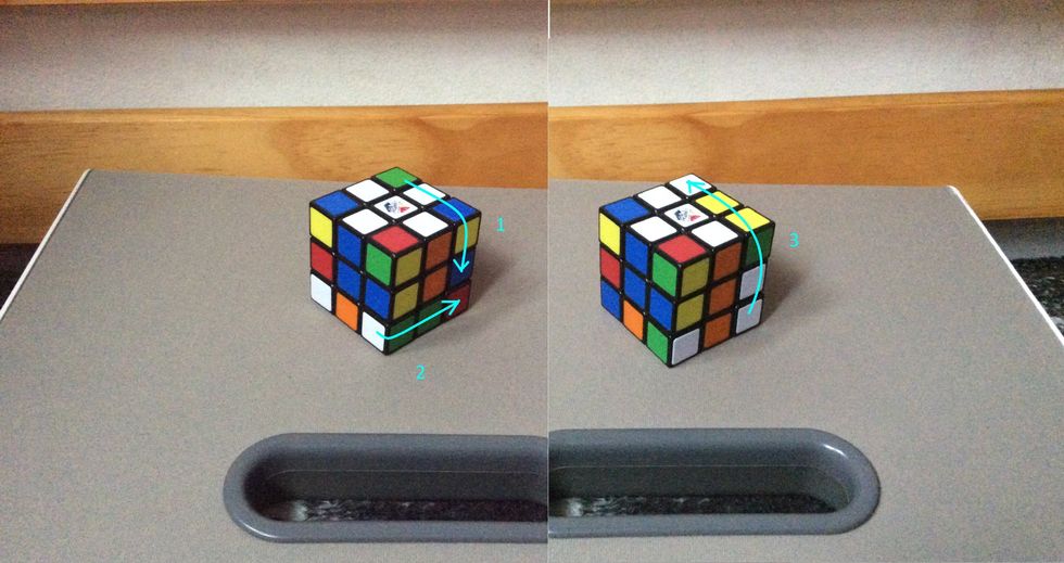 Next, turn the side down, then turn the bottom to the right. After that, turn the side back up.