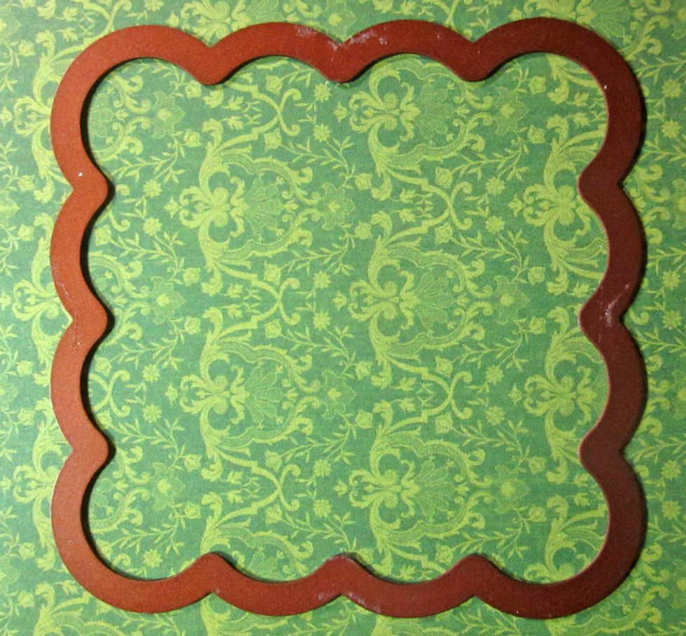 Next use a die to cut out a front. You'll want to use one that is about 3 1/2 x 3 1/2 inches in sizes. I'm using the scalloped square from Spellbinders Dies.