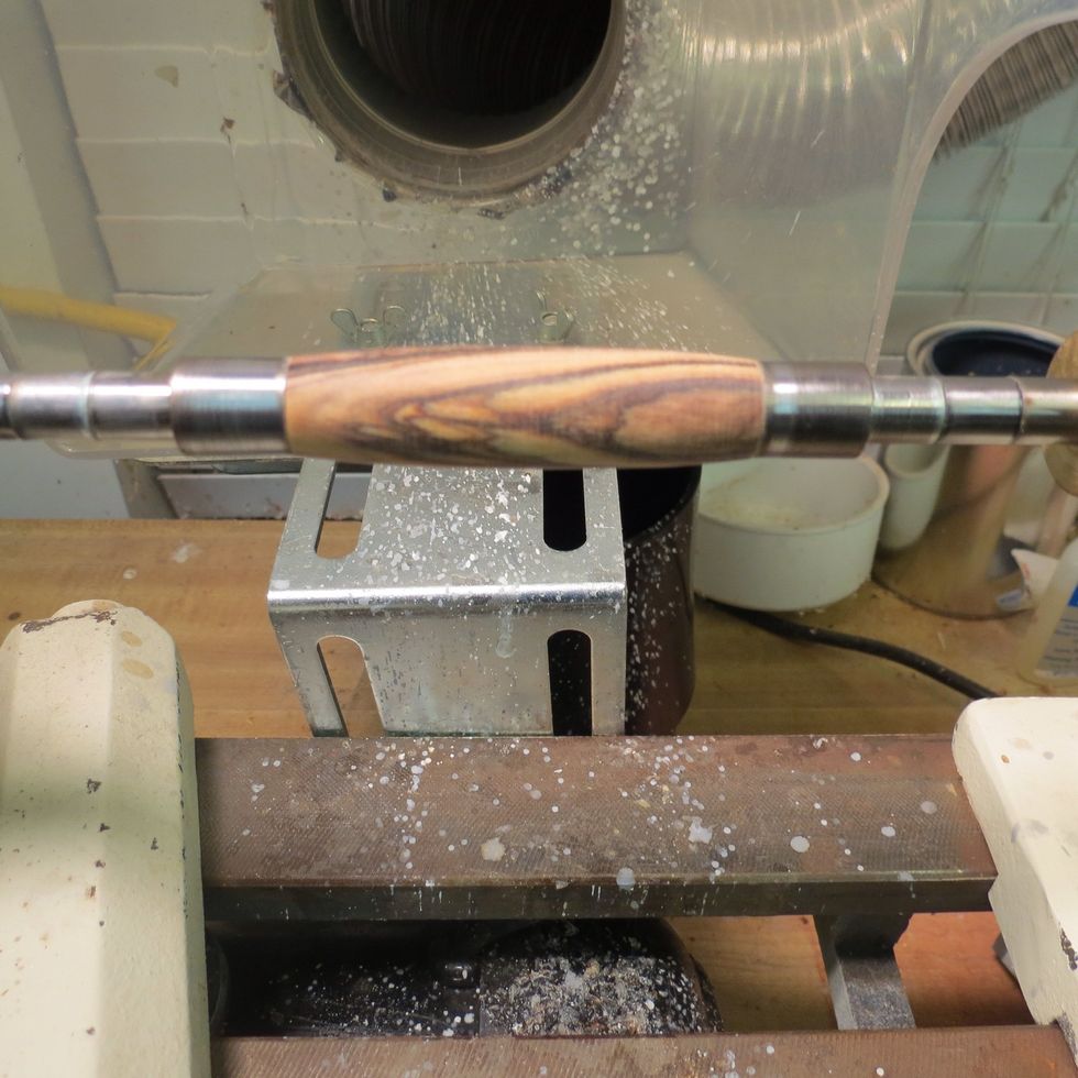 Next, use sandpaper, and shape the blank all the way down to the bushings (the metal parts on both ends of the blank). I usually start with 120 grit and move up to 2000 grit sandpaper.