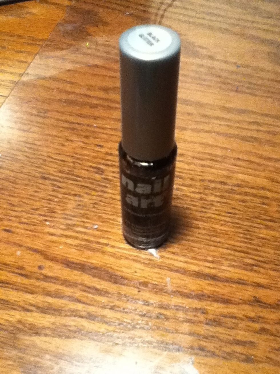 Next, use the black polish with the nail art brush to partially outline the splotches. Again, it doesn't have to be perfect. Let it dry completely.