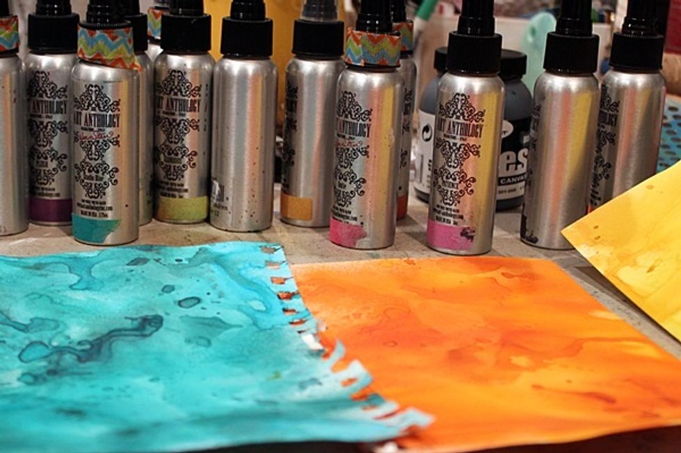 Next using mix of Colorations spray completely cover several sheets of cardstock, once theses sheets are dry stamp and die cut your flowers out using Heartfelt's- Arianna Blooms set.