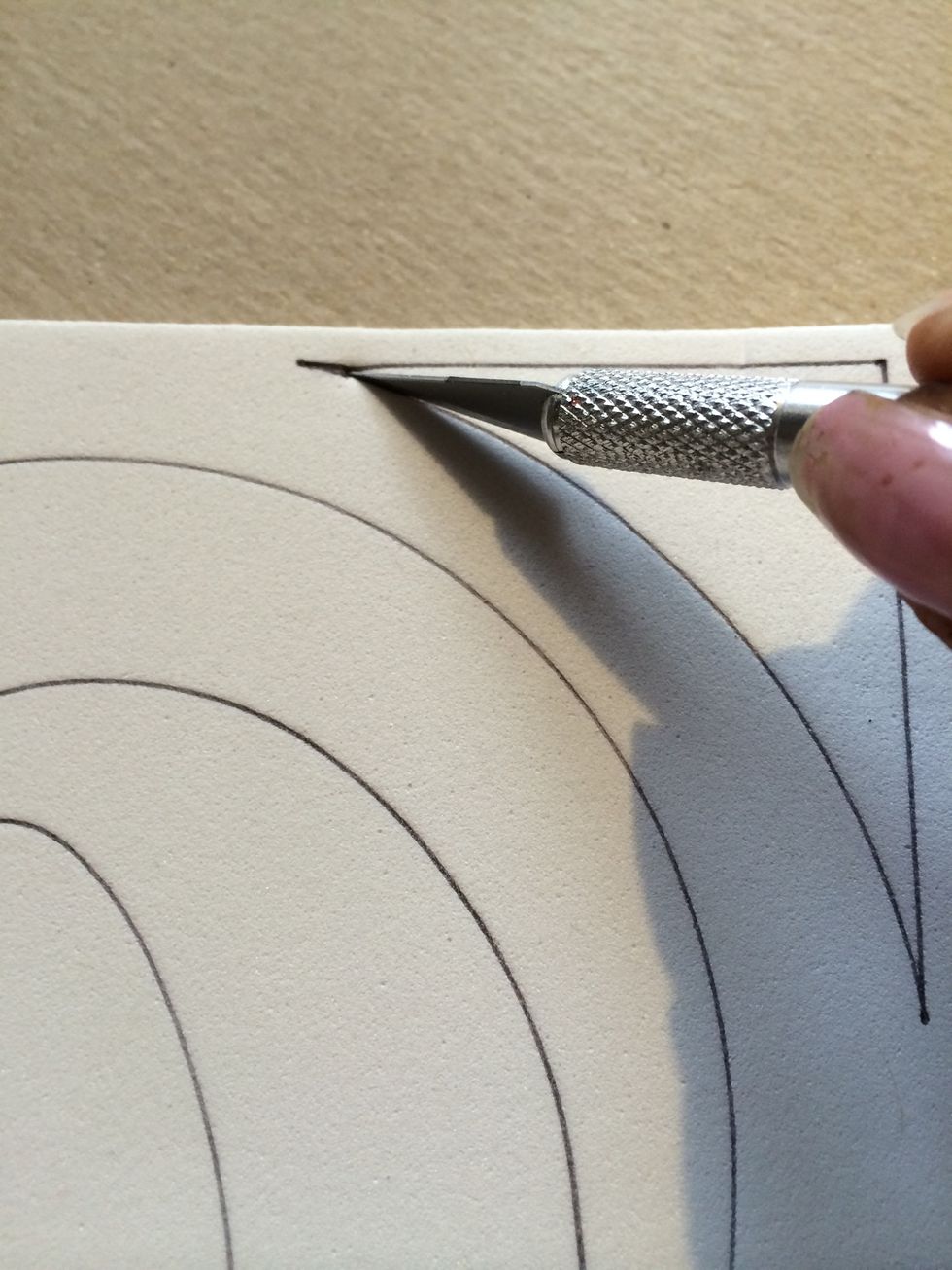 Next, using your exacto knife, cut out the segments of your pattern. Use your stencil as a guide if you need to. (Sometimes you wonder "does that stay or go!? Lol)