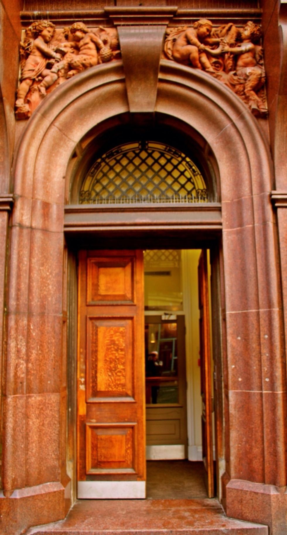 Next walk down Grey Street, recently voted England's most beautiful street, near the corner with Mosley St, notice this doorway...