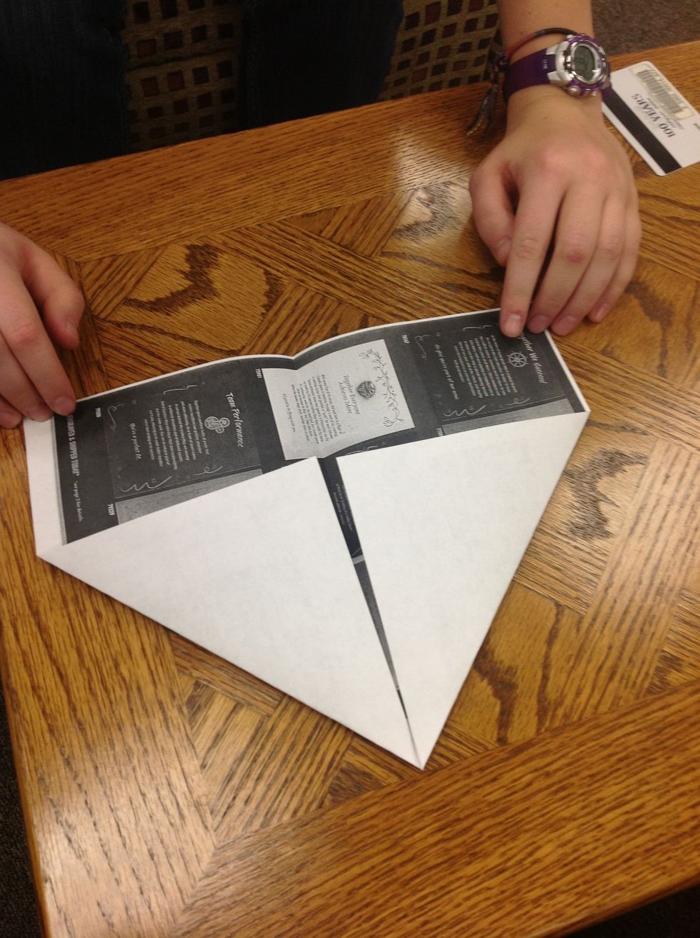 Next, we are going to fold the top two corners to make a triangle.