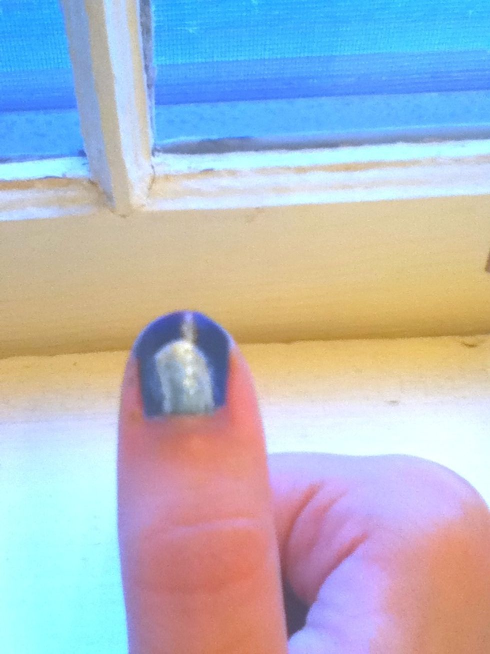 Next, we draw lines running down from the crescent on either side and fill in our ghost. It can always be touched up. I used the paint brush to create smooth edges, as my hands always seem to shake.