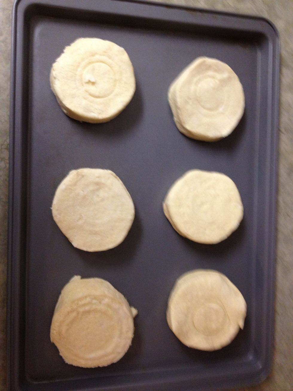 next, we prepare the ready-to-bake biscuits according to the directions on the package.
