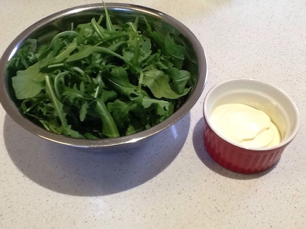 Next we will be preparing the salad for plating up. All you need is Greek yogurt and some rocket. If you want to add Dijonnaise mustard you can. And that's all you need to do.