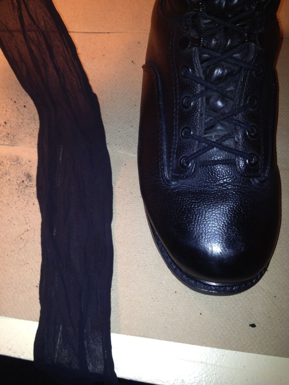Next, while firmly holding the boot, take an old pair of ladies nylons, and stretch it tight across the toe and rub quickly until you here squeaking.