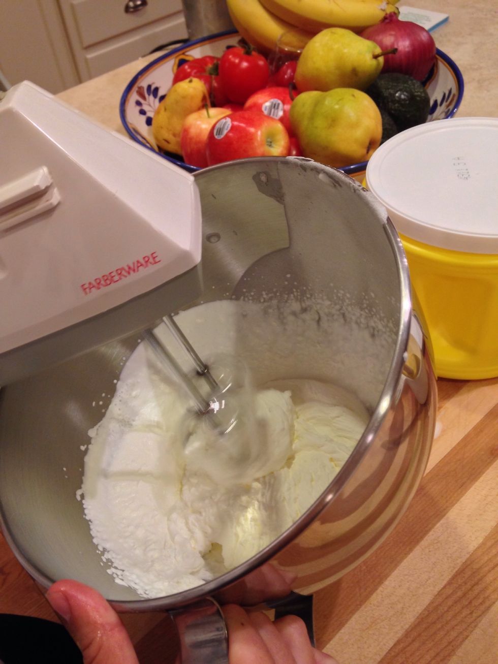 Next whip a half a cup of heavy cream in a large mixing bowl at high speed.