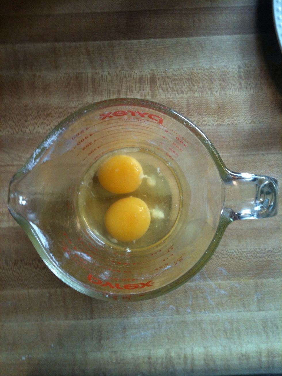 Next whisk two eggs.