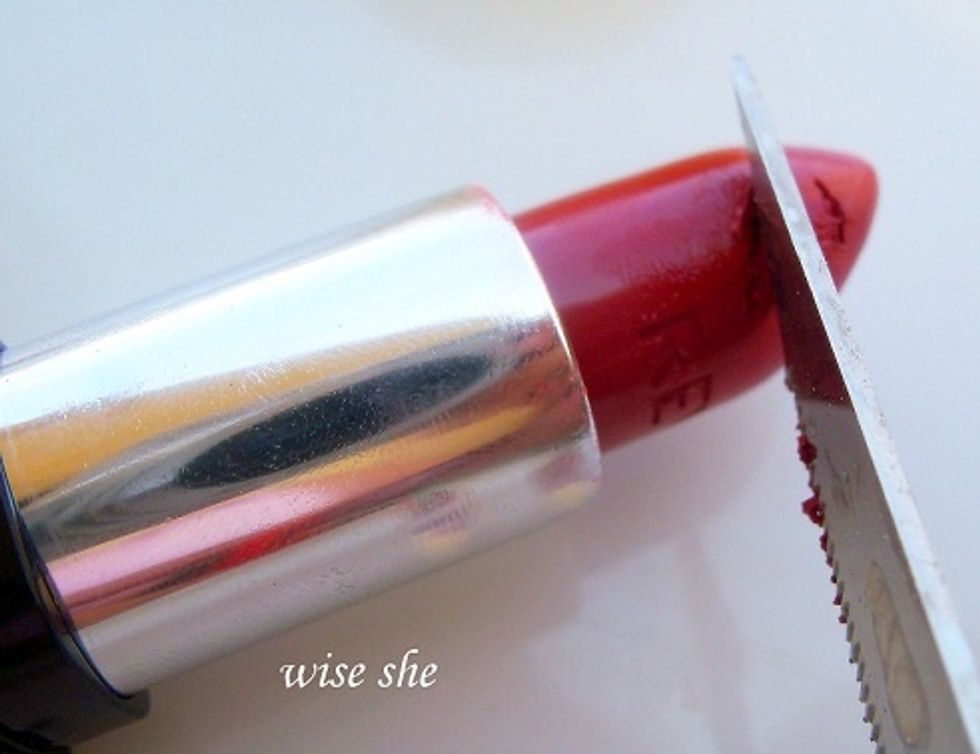next with the kitchen knife scrape a little if the lipstick.....