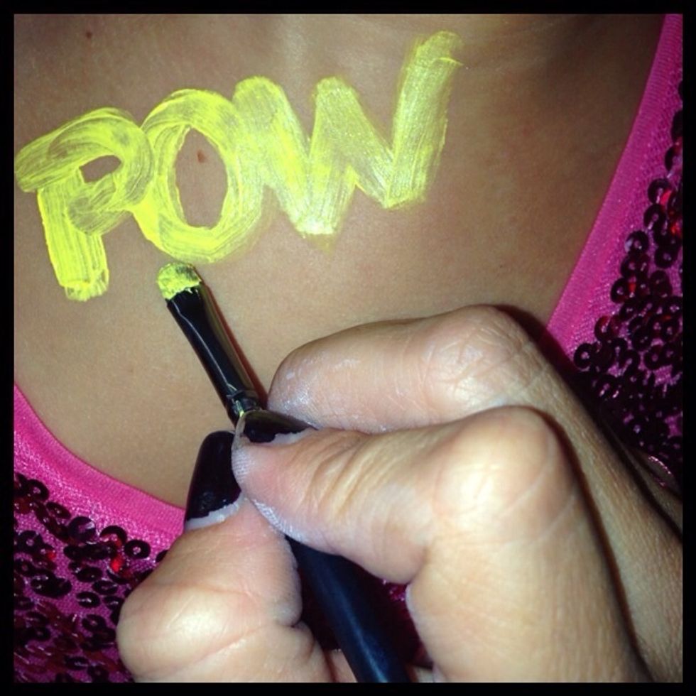 Next with the yellow paint write POW!!! Or any saying/word of your choice