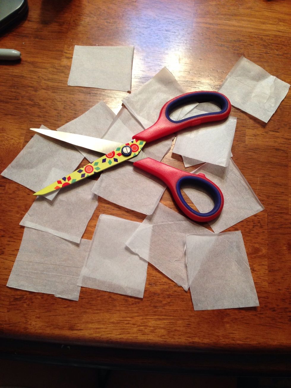 Next, with your scissors cut squares out of your tissue paper.