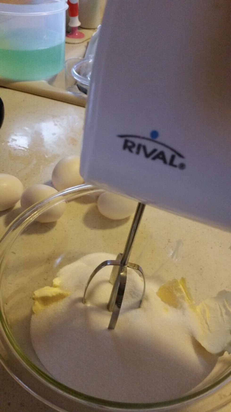 Next, you add a cup of sugar in the same bowl
