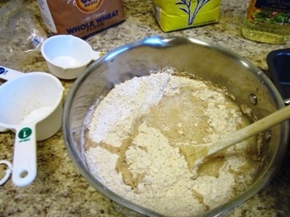 Next you add the sugar, salt, and 3 cups of flour.  Some people say to add the flour slowly, but that's only to keep it from flying away in a big cloud. I just add it all at once. Mix it all up.