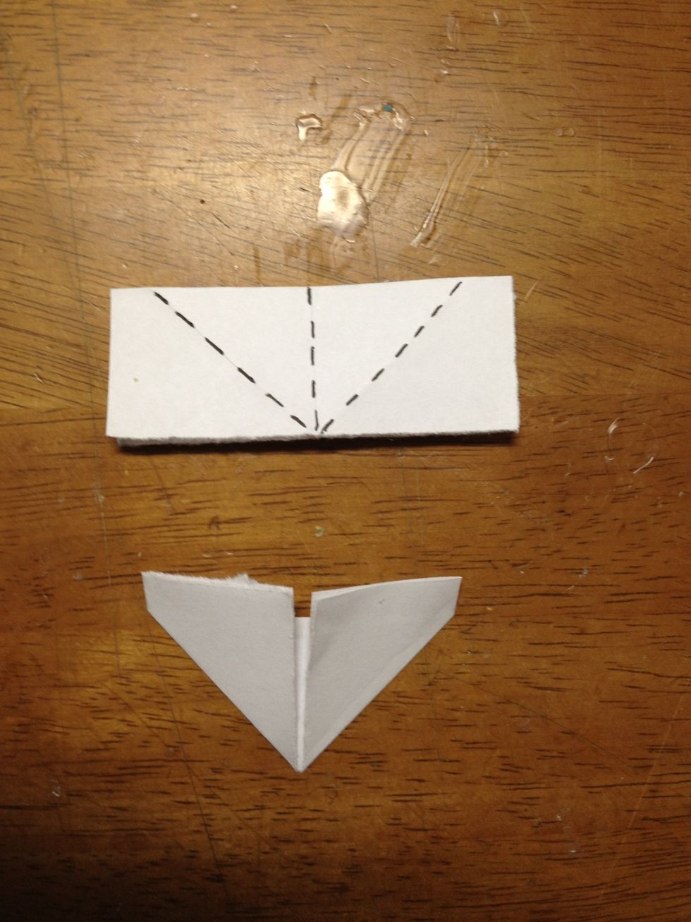 Next, you are going to fold along the dotted lines. Typically, I take the side where the piece opens up and I fold it so it lies flat along the center line. (do for both left and right).