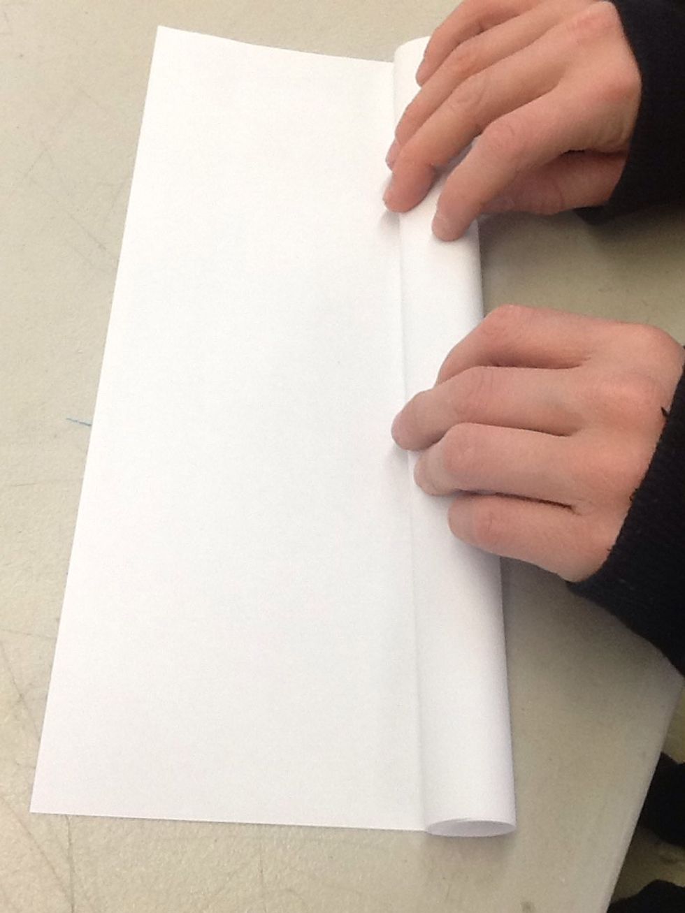 Next you are going to roll up your paper in to a tube like this.