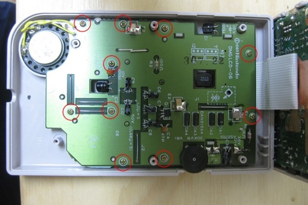 Next, you have to remove ten screws holding the display board onto the front case. From this point forward, all the screws we\u2019ll be dealing with are Phillips cross heads.