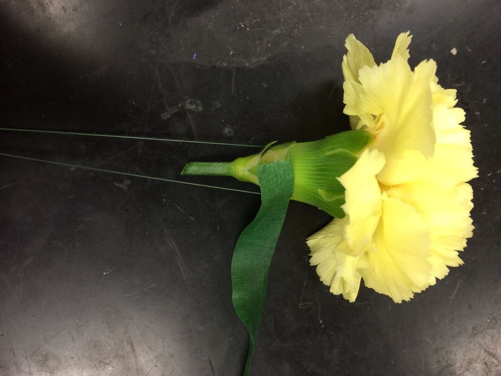 next you have to tape the flower so that the wire is completely covered